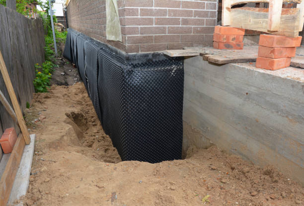 Happy homeowners after waterproofing job in Stinesville